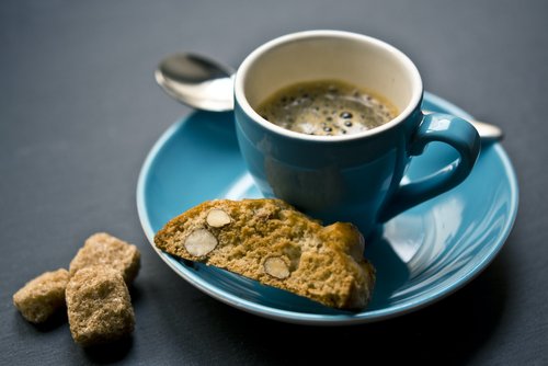 turquoise coffee cup and biscotti